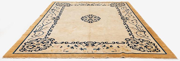 An antique Chinese carpet, 404 x 304 cm.