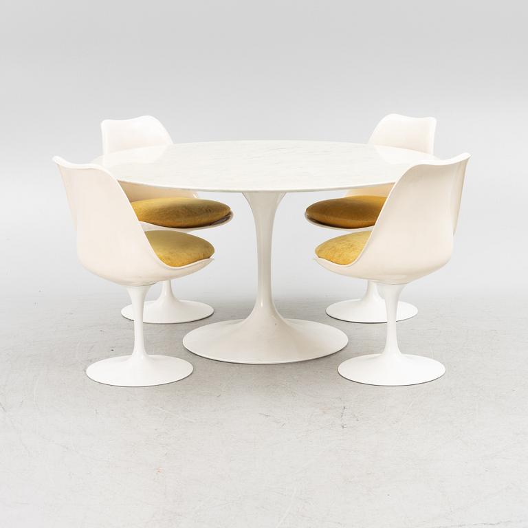 Eero Saarinen, a "Tulip" dining table with four chairs, 1970's.