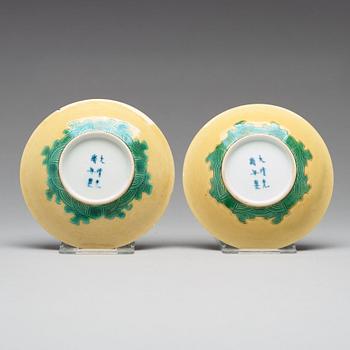 A pair of yellow glazed tea cups with stands, Qing dynasty with Guangxus six character mark (1875-1908).