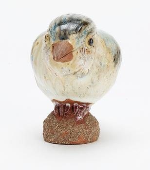 A Tyra Lundgren stoneware bird, signed with a seal.