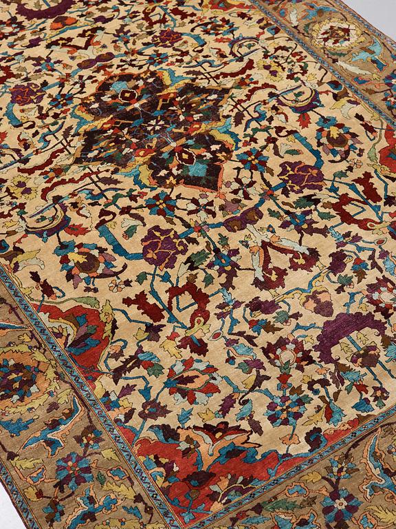 A RUG. An antique silk Kashan so called Motachem. 202,5 x 136,5 cm.