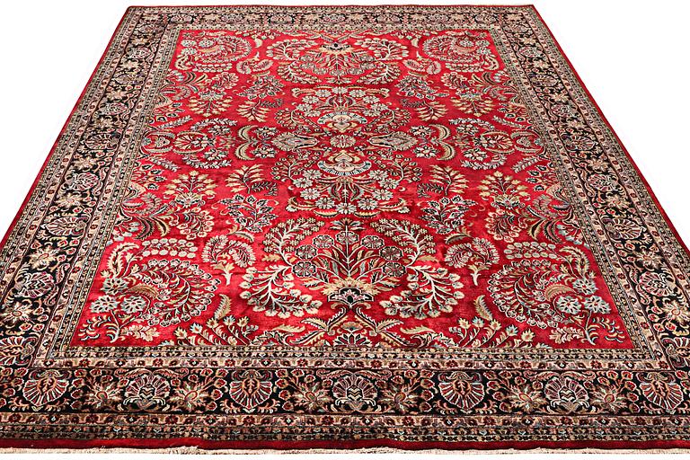 An oriental carpet, part silk, c. 360 x 274 cm.