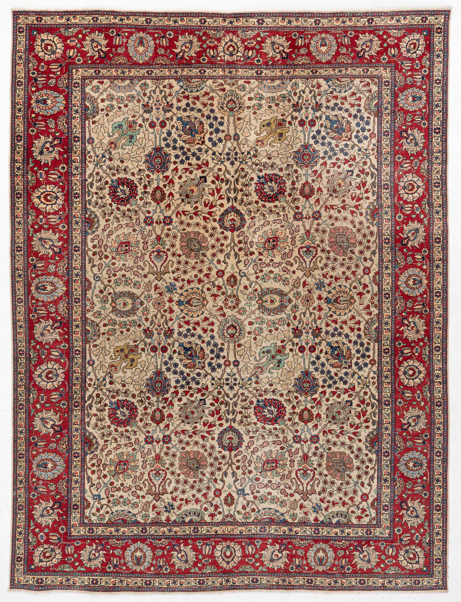 A Tabriz carpet, c. 385 x 287 cm.