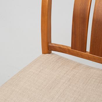 A 'Rimbo' walnut dining table and four chairs, second half of the 20th Century.