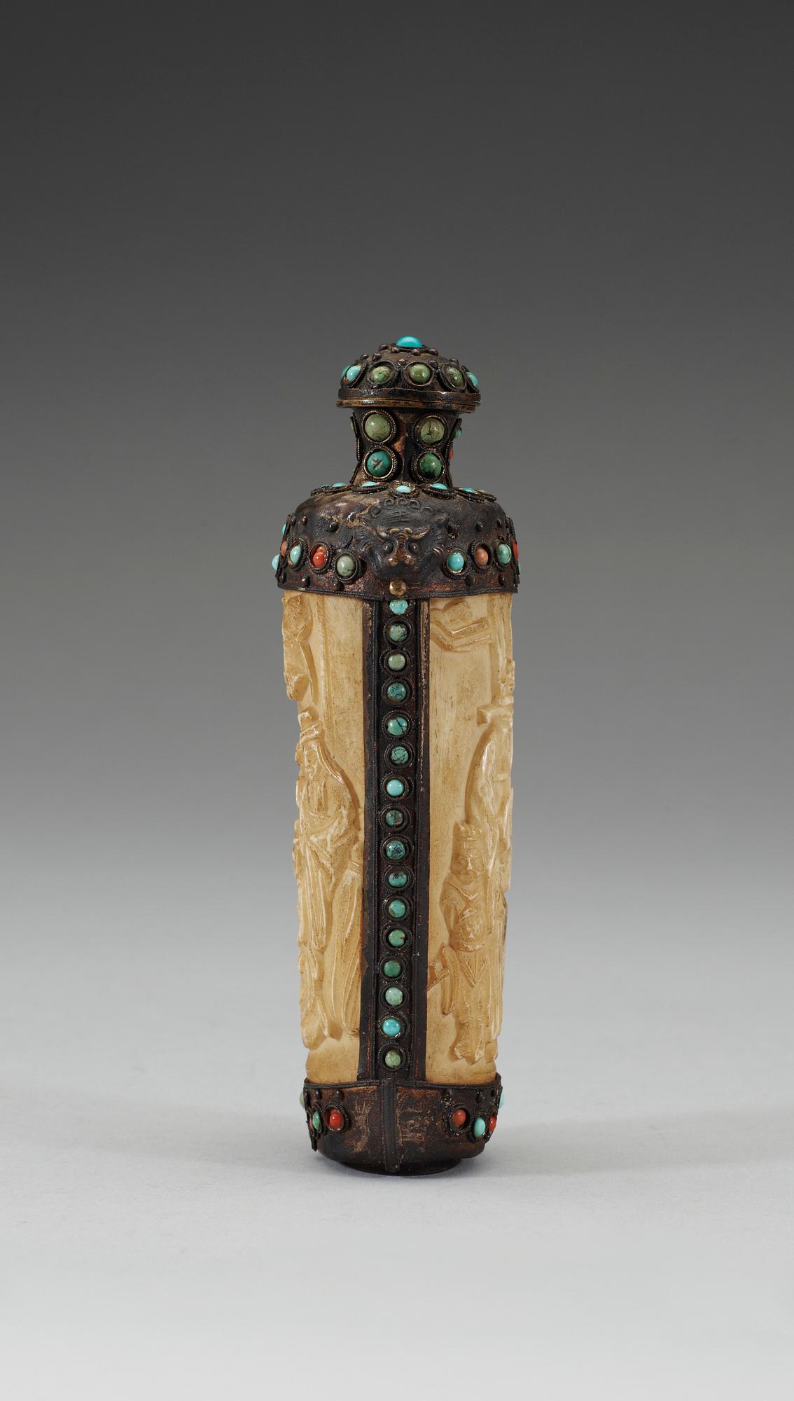 A turquoise inlayed metal framed ivory flask, late Qing dynasty (1644-1911).