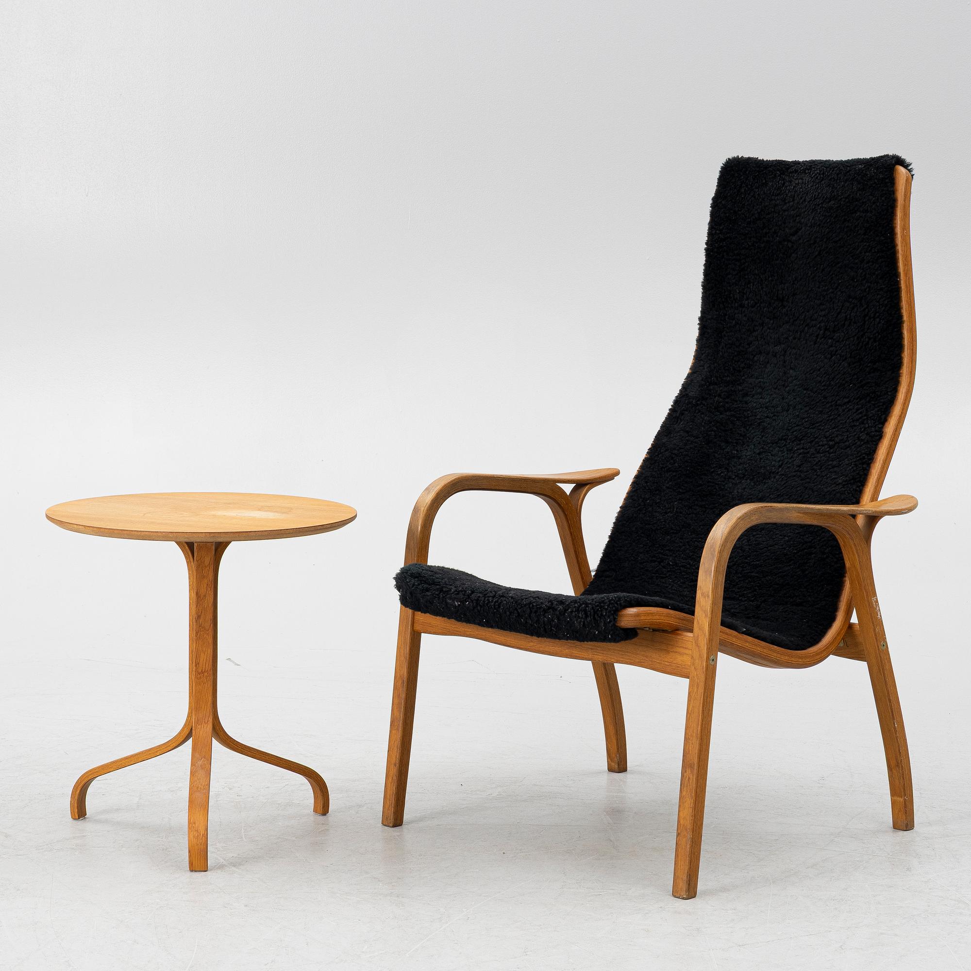 Yngve Ekström, a 'Lamino' armchair and sidetable, Swedese, Sweden, early 21st century.