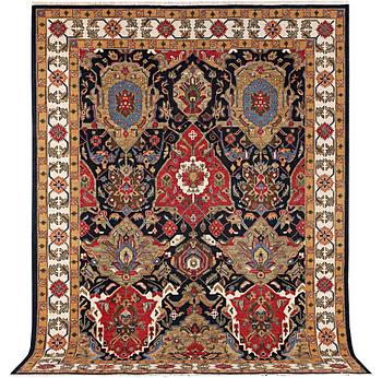 An Oriental carpet with Mamluk design, c. 364 x 276 cm.