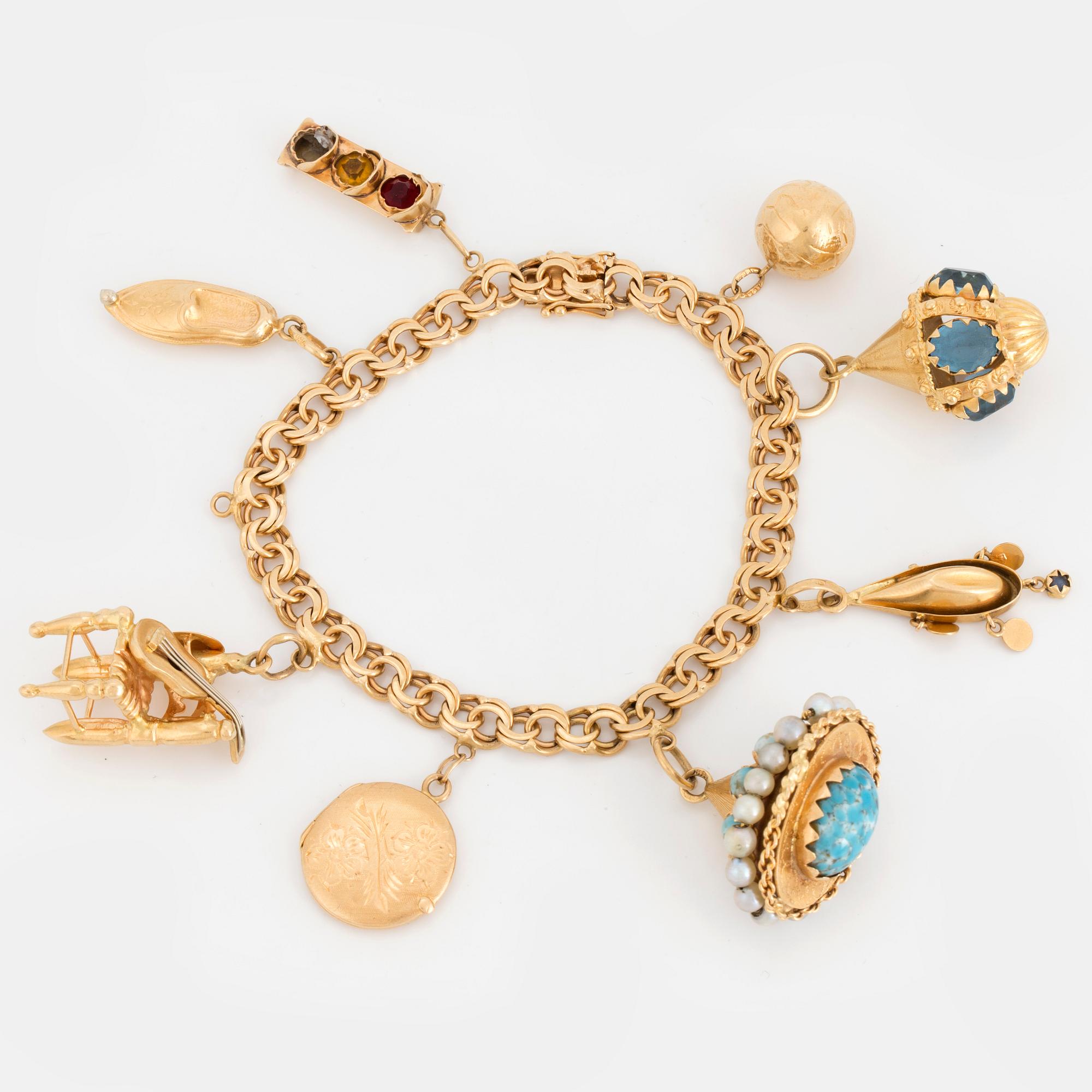 18K gold charm bracelet.