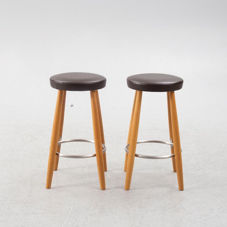 Hans J. Wegner, a pair of bar stools, CH 58, Carl Hansen & Son, Denmark, 21st century.
