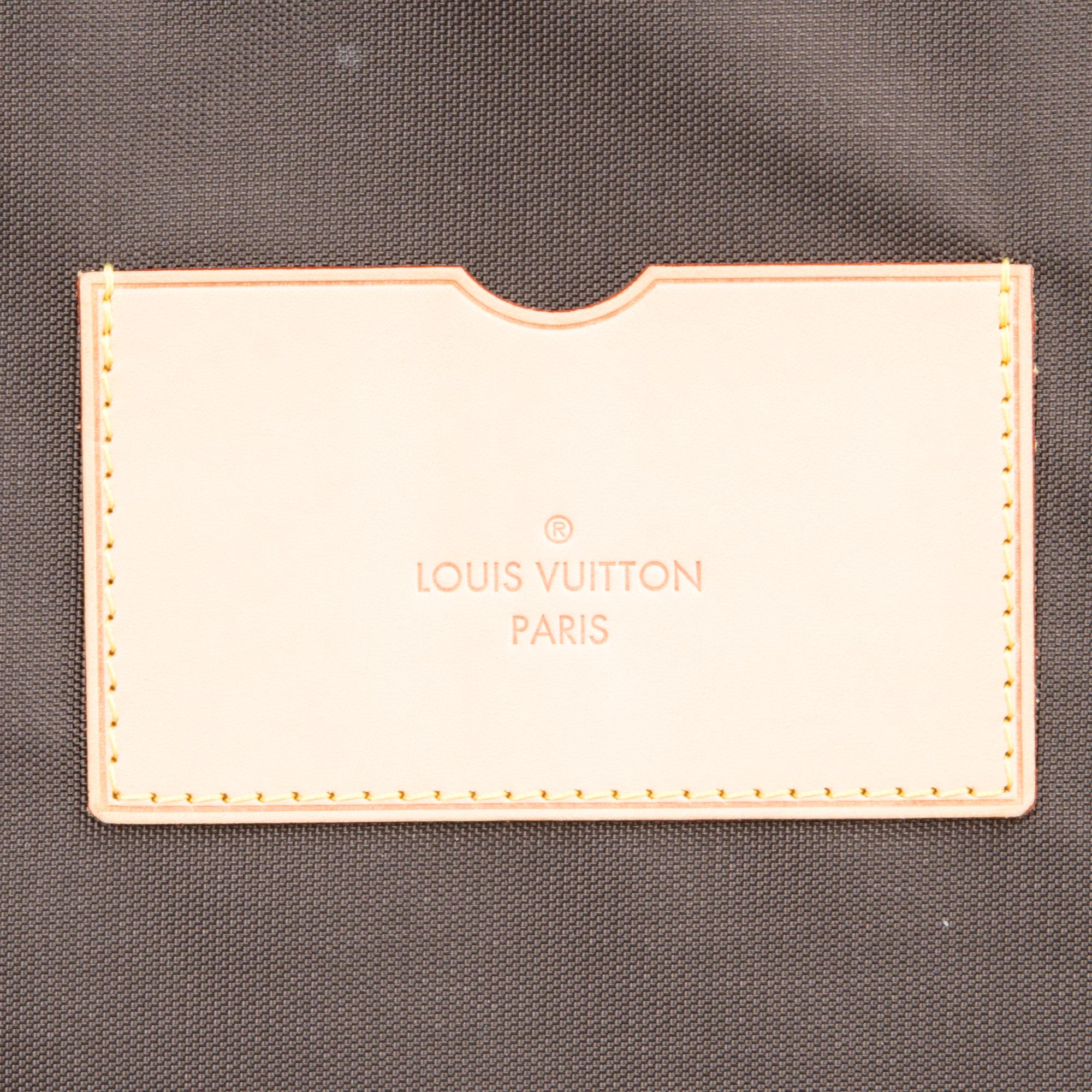 A Monogram Canvas Pégase 65 Suitcase with a Protective Cover.