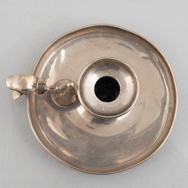 A silver chamber candlestick with mark of R & S Garrard & Co, London, England 1848.