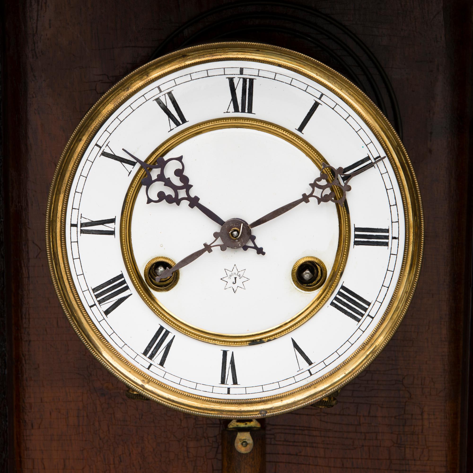 A neo renaissance German Junghans wall clock from around the turn of the 20th Century.