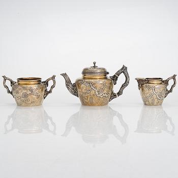 A 9-piece parcel-gilt sterling silver tea set, maker's mark of Samuel Smily, Goldsmiths Alliance Ltd, London 1873-74.