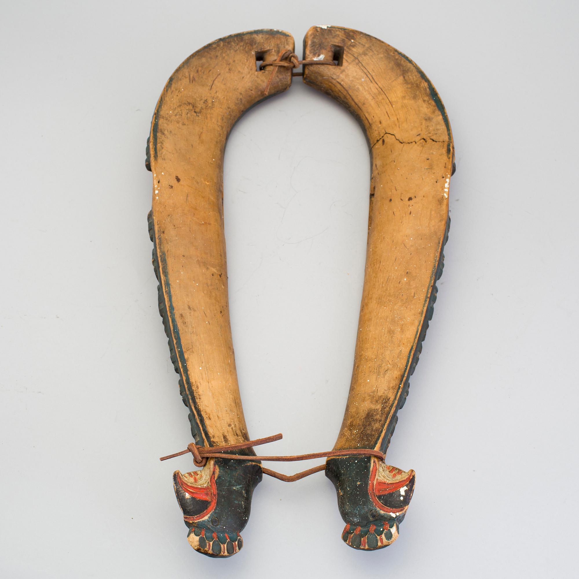 A pair of carved and painted folk art horse hames 18/19th century.