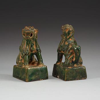 A pair of green glazed joss stick holders, Ming dynasty (1368-1644).