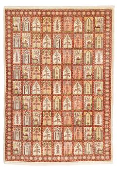 A silk Hereke rug, ca 93 x 68 cm.