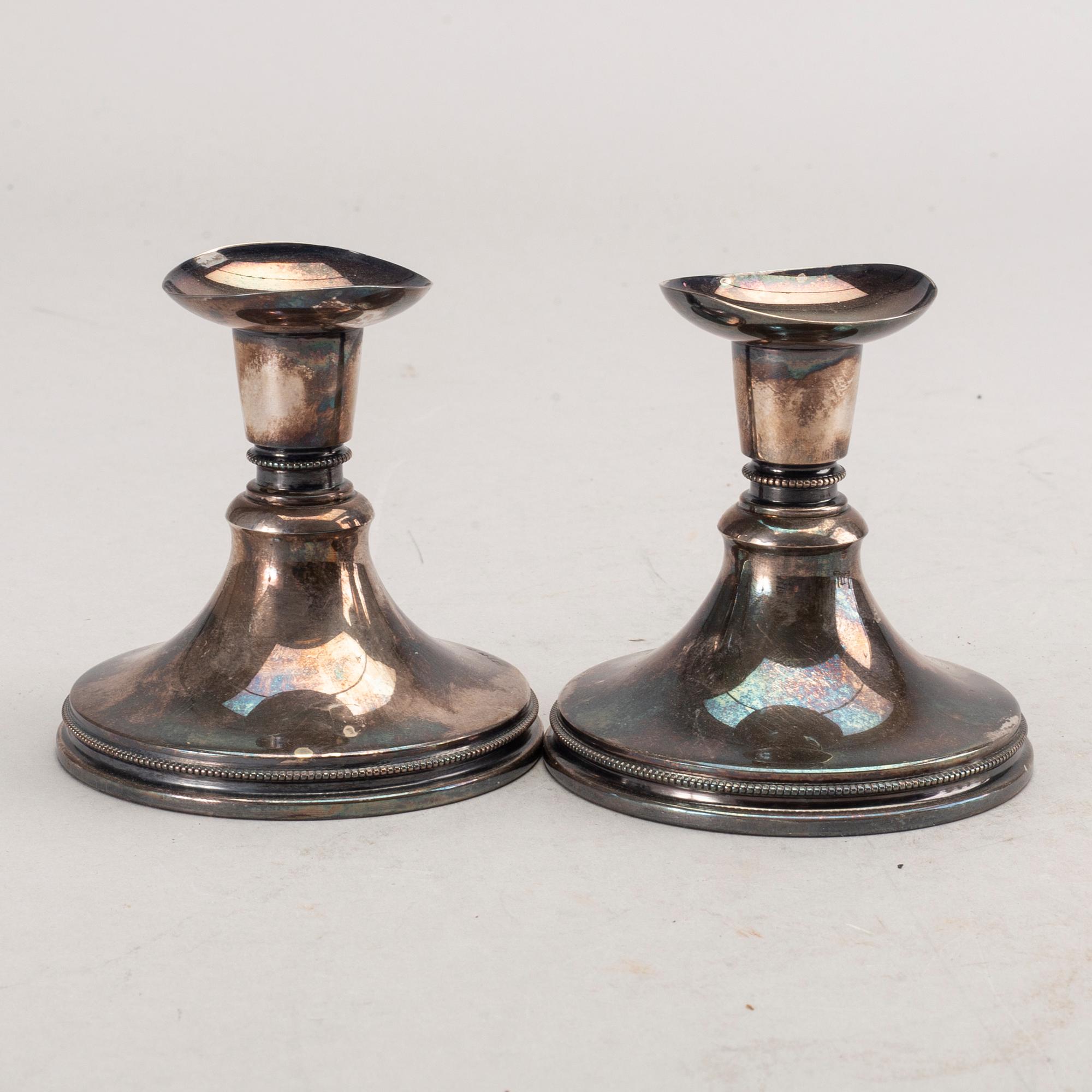 A set of three pair of Swedish 20th century silver candle sticks.
