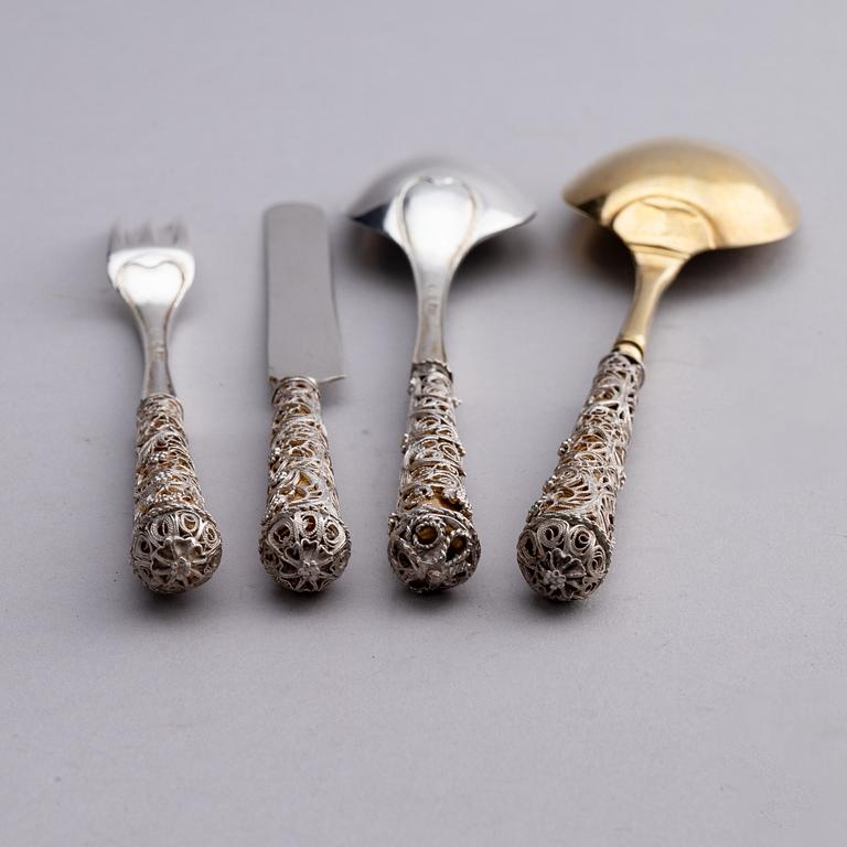 A Swedish parcel-gilt silver and filigree four-piece travel cutlery set, marks of Gustaf Otto Sjöberg, Falun 1813.