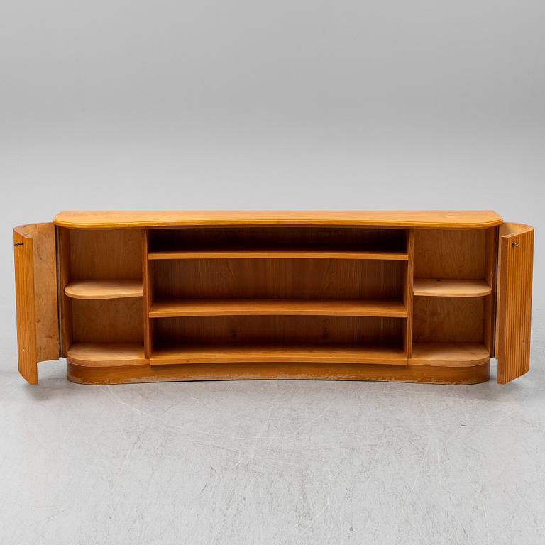 A 1940s elm veneered shelf.