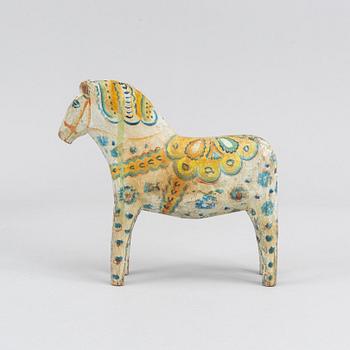 A painted Swedish wooden horse from the first half of the 20th century.