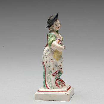 An English creamware figure representing Autumn, circa 1800.