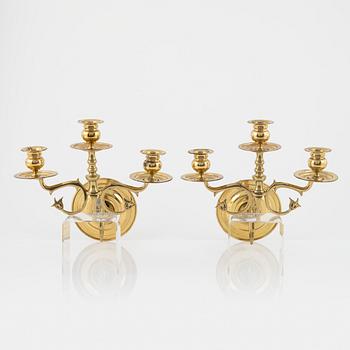 A pair of brass wall sconces, first half of the 20th Century.