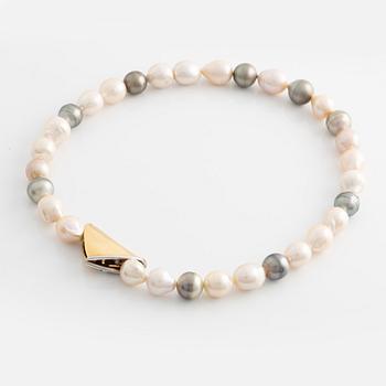 Ole Lynggaard lås 18K guld med en rund briljantslipad diamant.