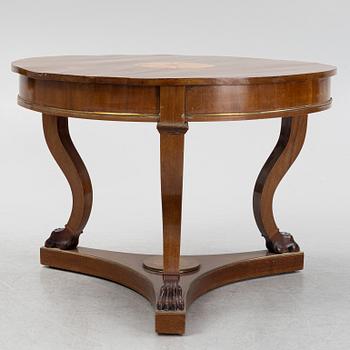 A mahogany veneered Empire style table, first half the 20th Century.