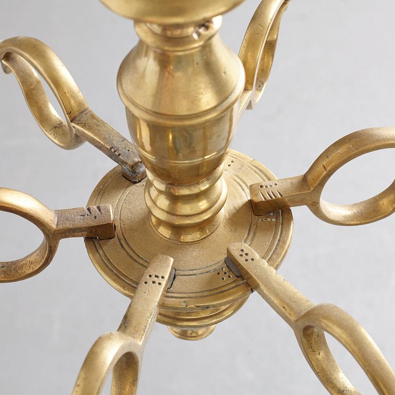 A six-light 18/19th century brass chandelier.