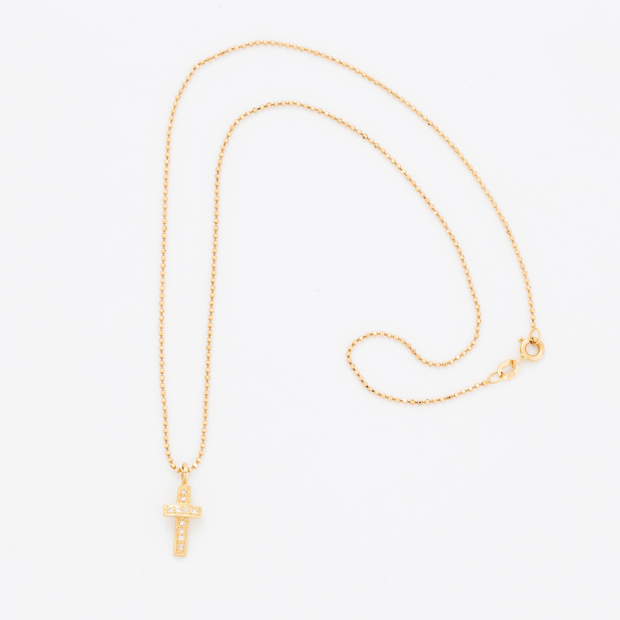 Efva Attling, 18K gold and brilliant-cut diamond cross pendant.