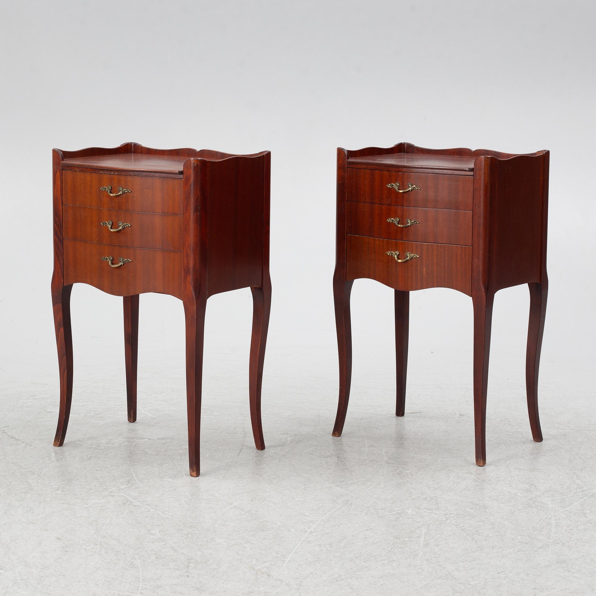 A pair of Rococo style bedside tables, second half of the 20th Century.