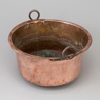 A 19th century copper cauldron.