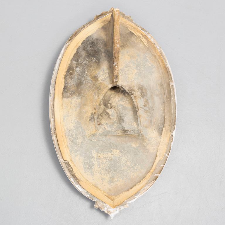 A ceramic wall relief, circa 1900.