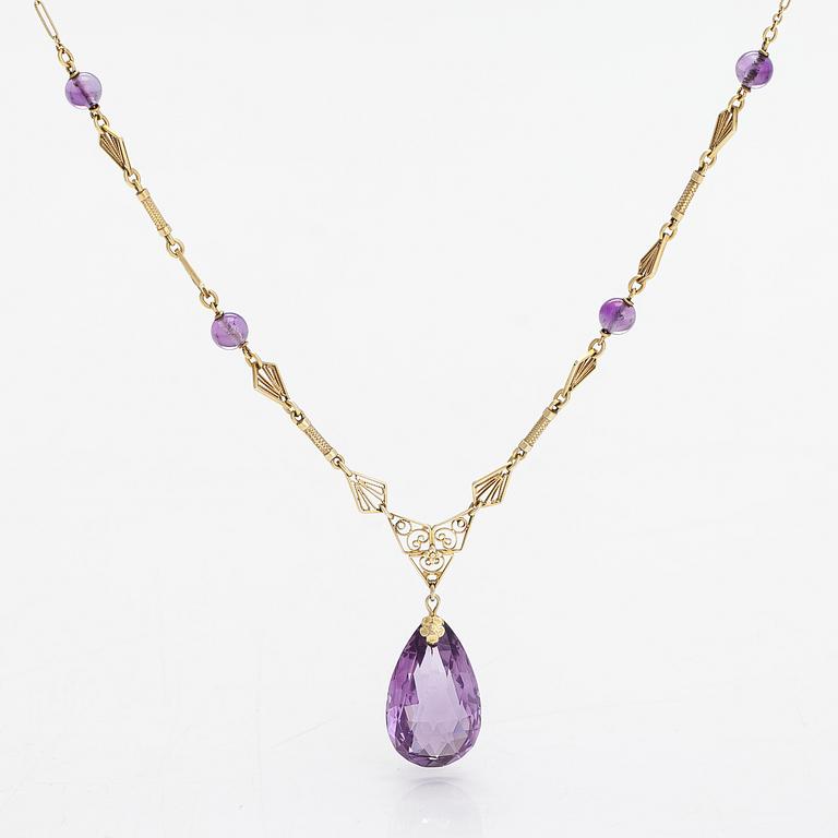 A 14K gold and amethyst neckalce.