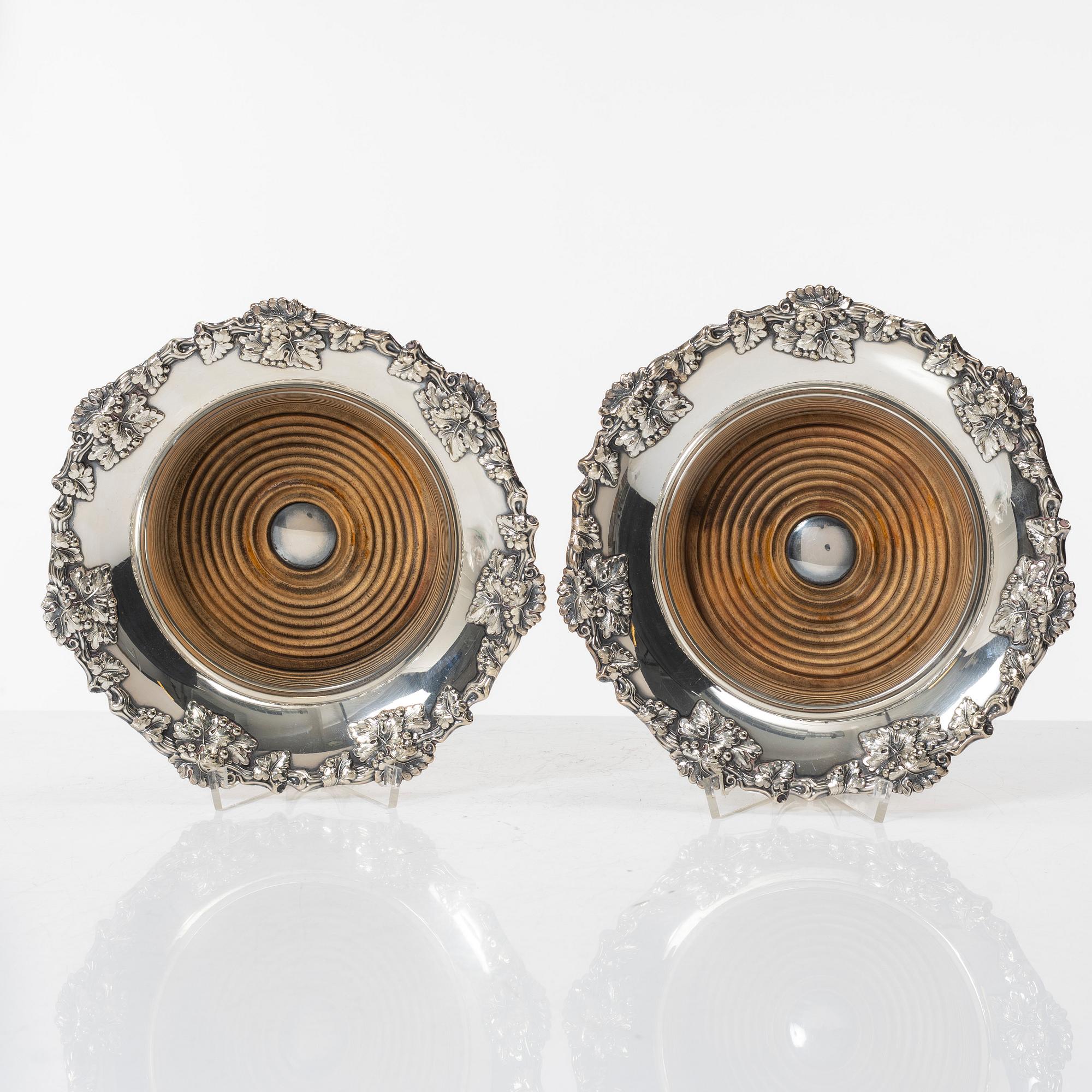 A pair of silver plated coasters, England 20th century.