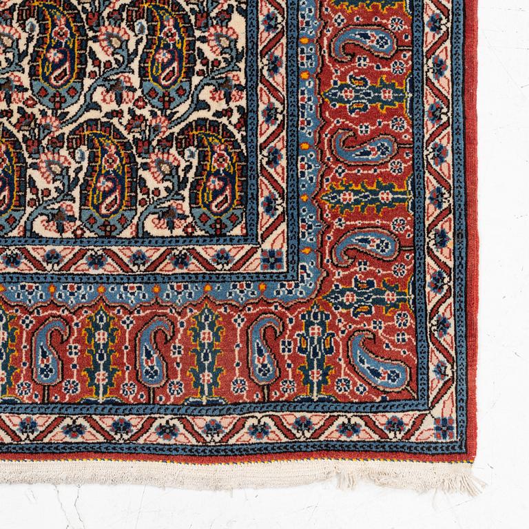 An oriental rug, c. 207 x 138 cm.