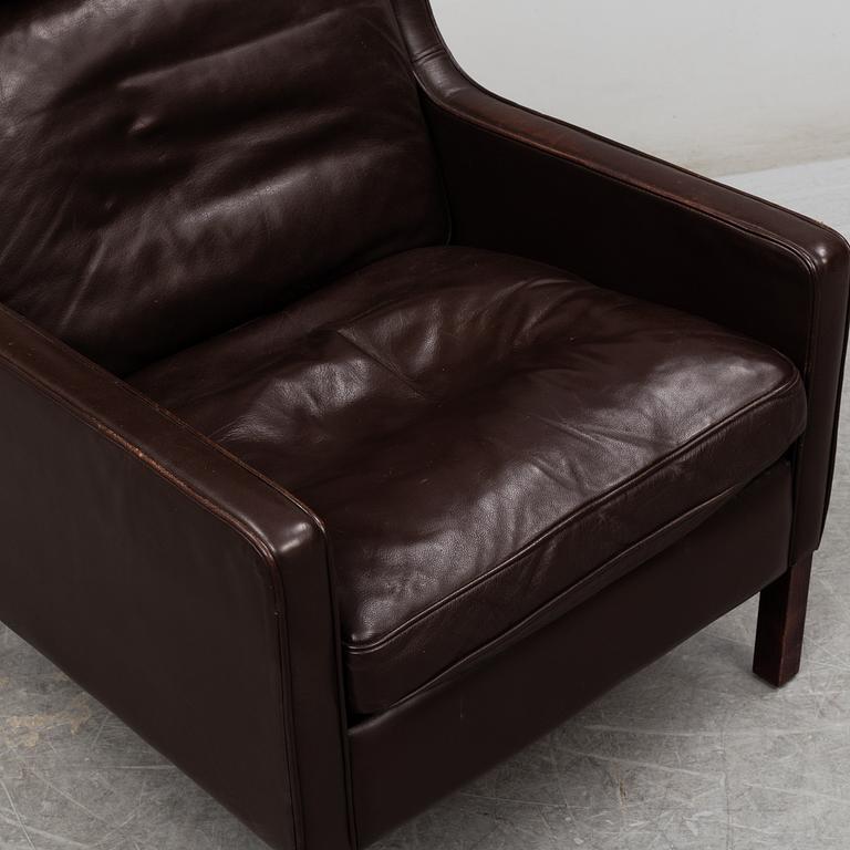 A leather covered 'Lulu' wing-chair from Stouby, Denmark, second half of the 20th Century.