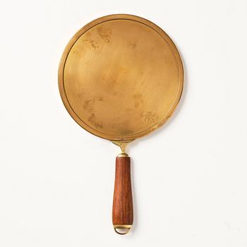 Firma Svenskt Tenn, a brass and teak hand mirror model "H 2156", mid 20th century.