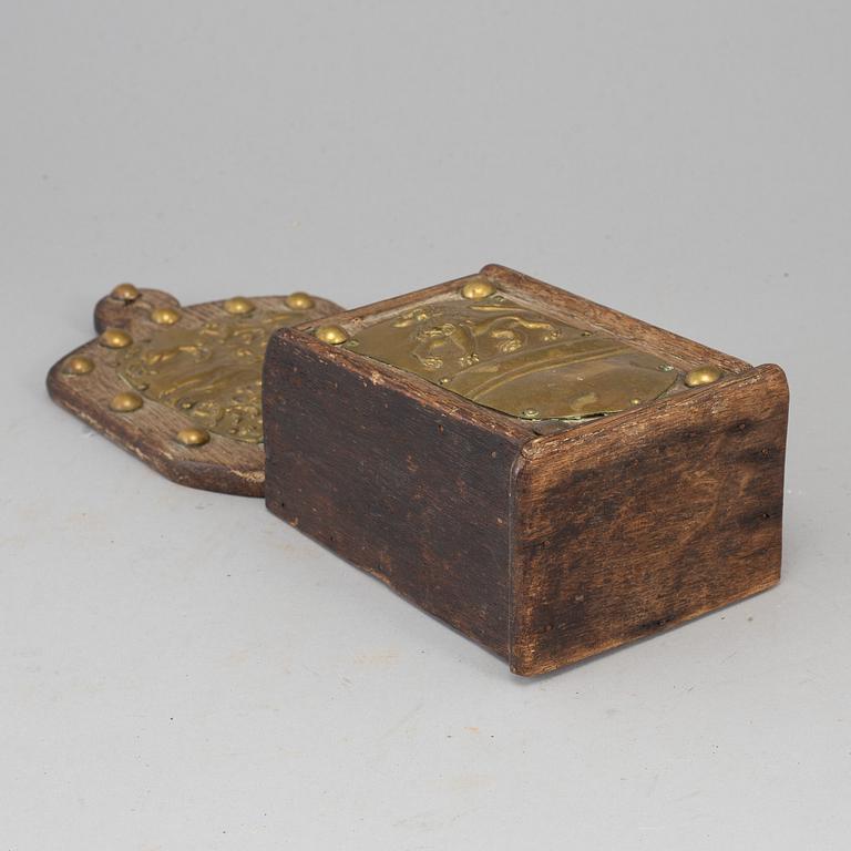 An 18th century brass and oak cutlery holder.