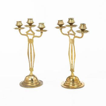Jugend/Art Nouveau, A pair of brass candelabra, early 20th century.