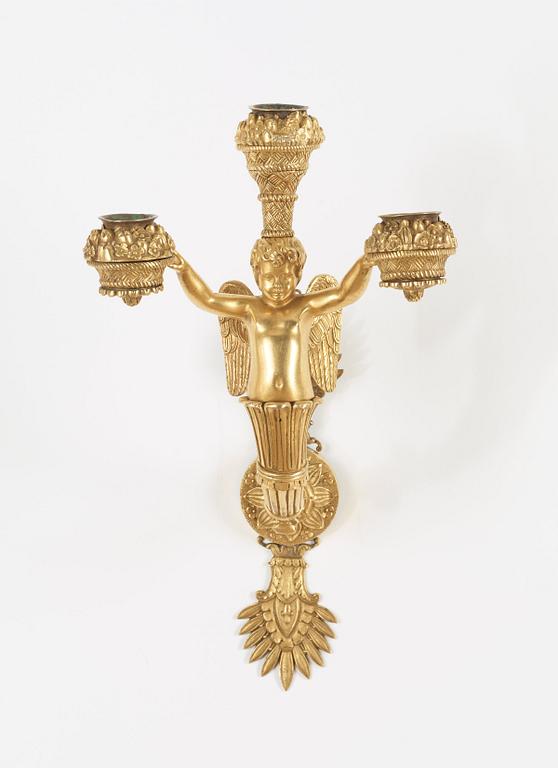 A pair of Empire early 19th century three-light wall-lights.