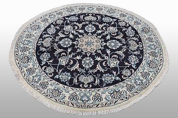 A rug, Nain, part silk, ca 140 x 140 cm.