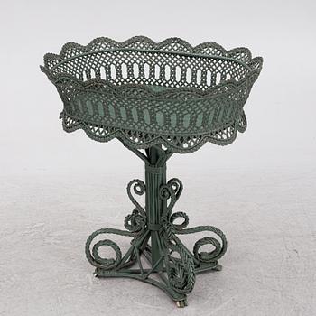 A wicker flower table, early 20th century.