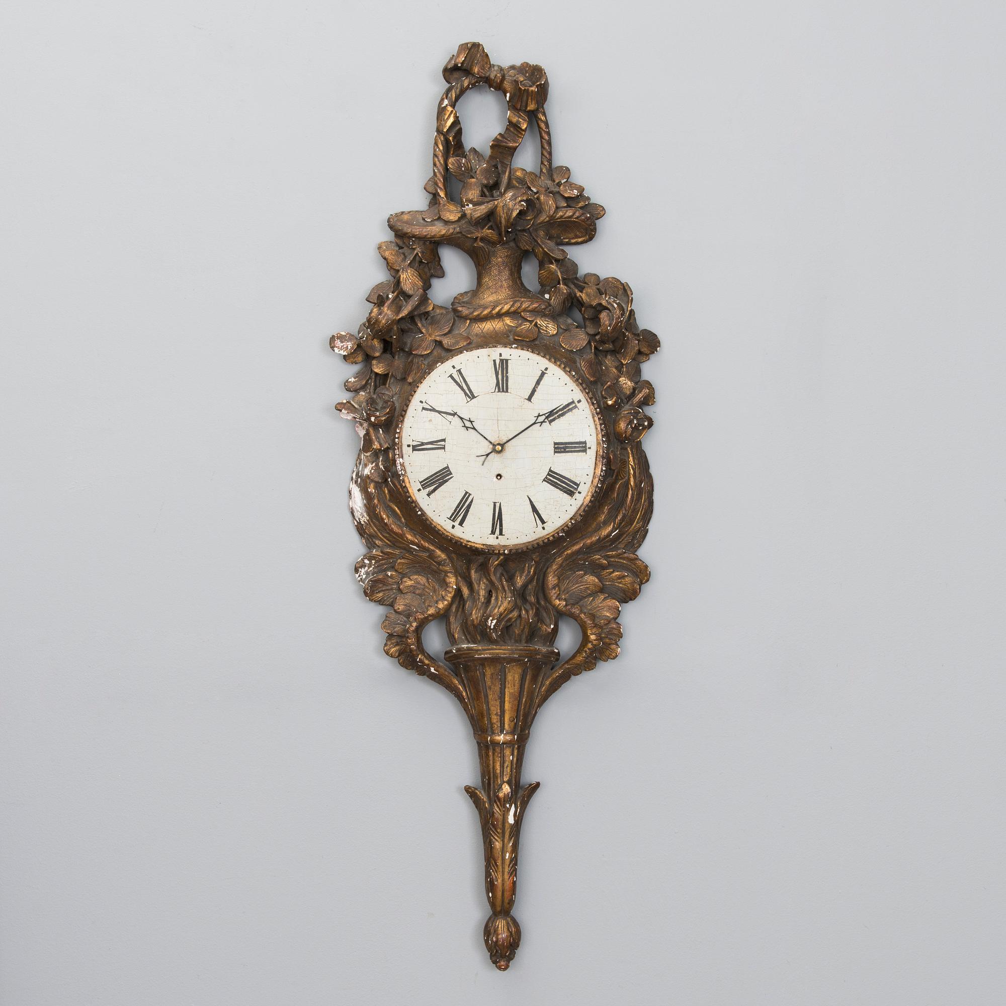 A 18th century wall clock.
