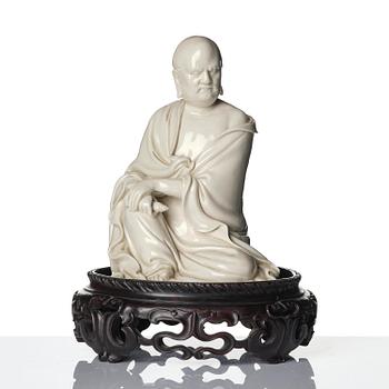 A blanc de Chine seated figure of Bodhidharma, Qing dynasty.