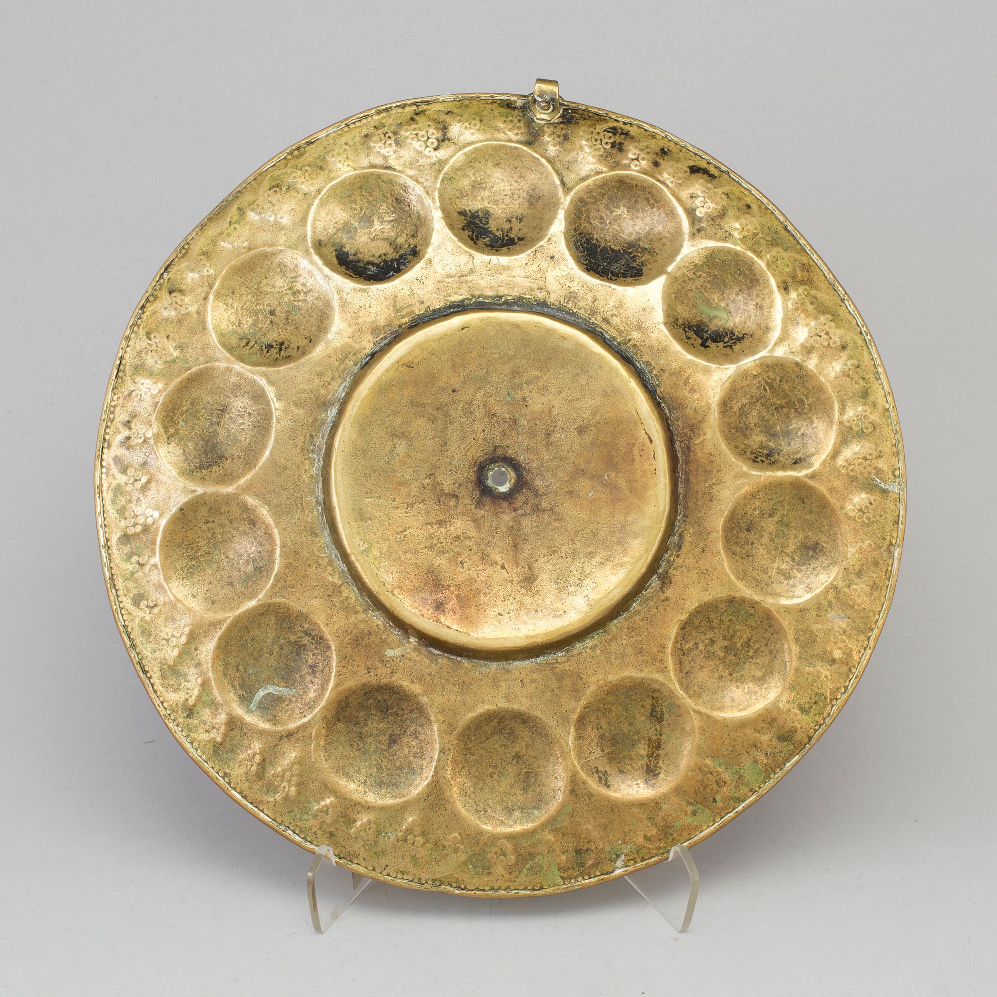 A probably 17th century brass wall plaque.