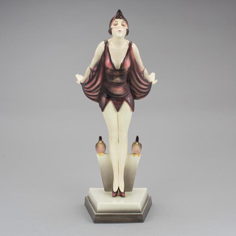 STEFAN DAKON, figurin, flintgods, Goldscheider, 1900-talets första hälft.