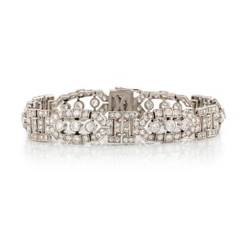 556. A platinum bracelet with round brilliant-and eight-cut diamonds.