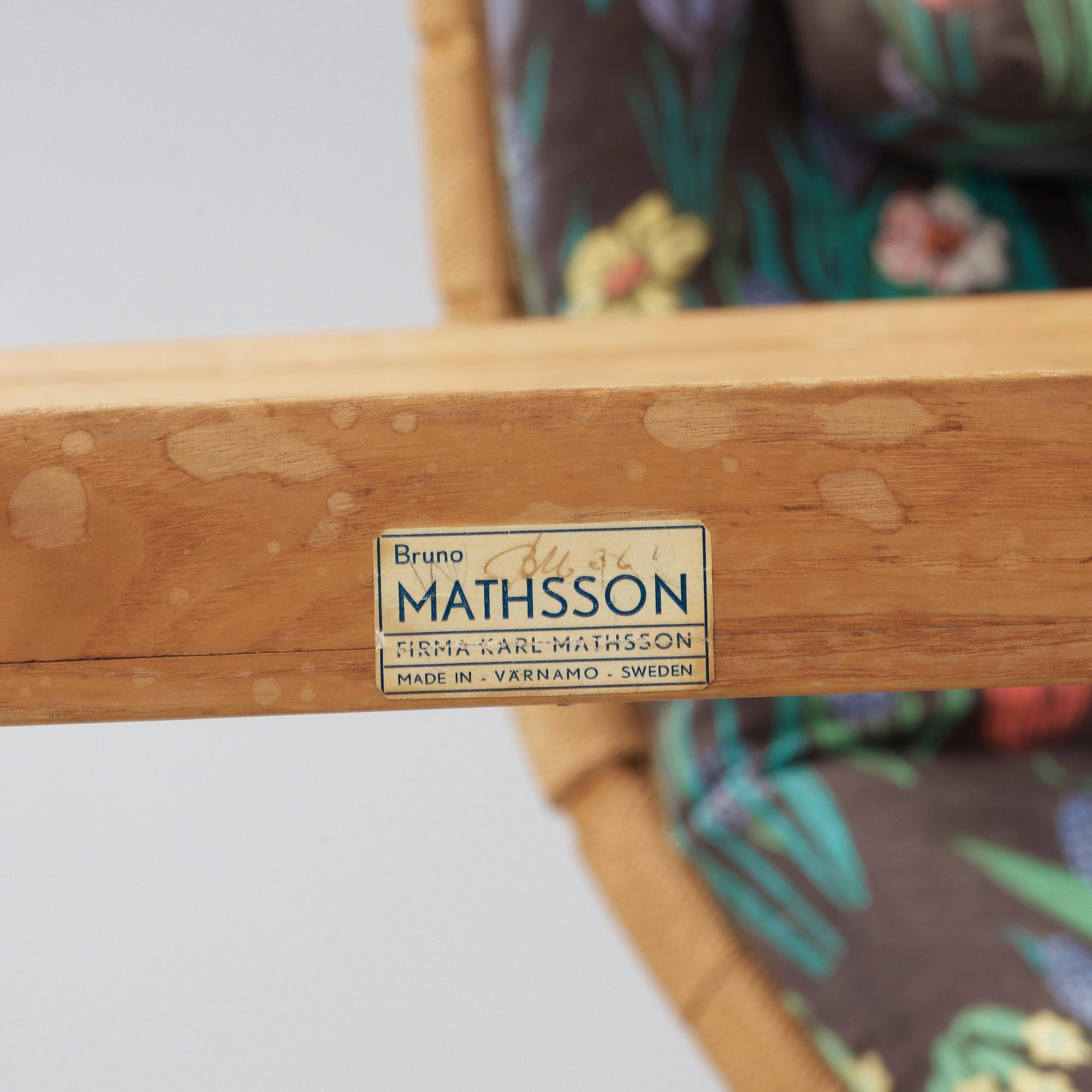 A Bruno Mathsson Swedish Modern chair with attached reading table, Karl Mathsson, Värnamo 1944.