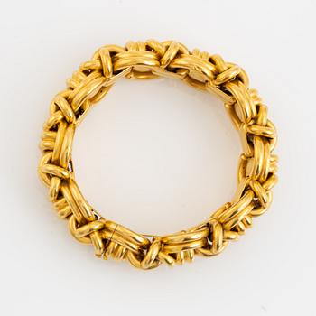 An 18K gold bracelet.